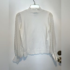 CeCe white pullover, mock turtleneck sweater with sheer embellished sleeves.